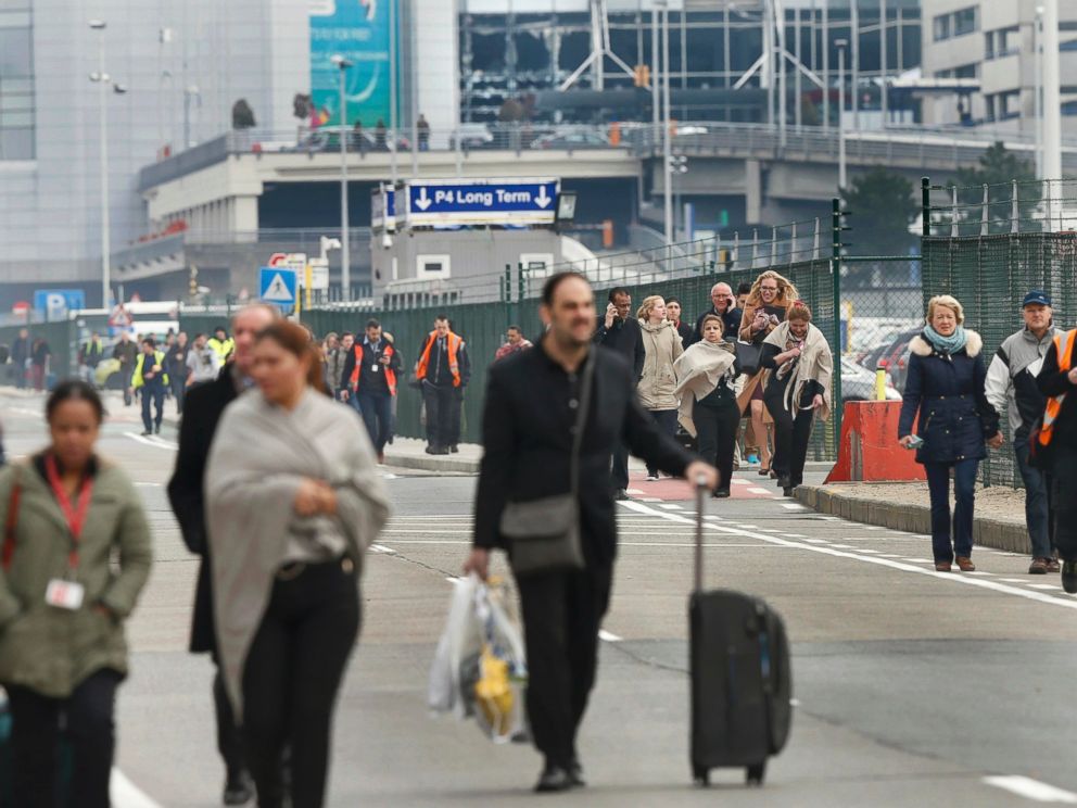 PHOTO: People leave the scene of explosions at Zaventem airport near Brussels, Belgium, March 22, 2016.