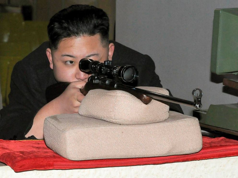 PHOTO: North Korean leader Kim Jong-Un aims a rifle at the Sporting Bullet Factory in this undated picture released by the North's KCNA news agency in Pyongyang on Feb. 23, 2012.
