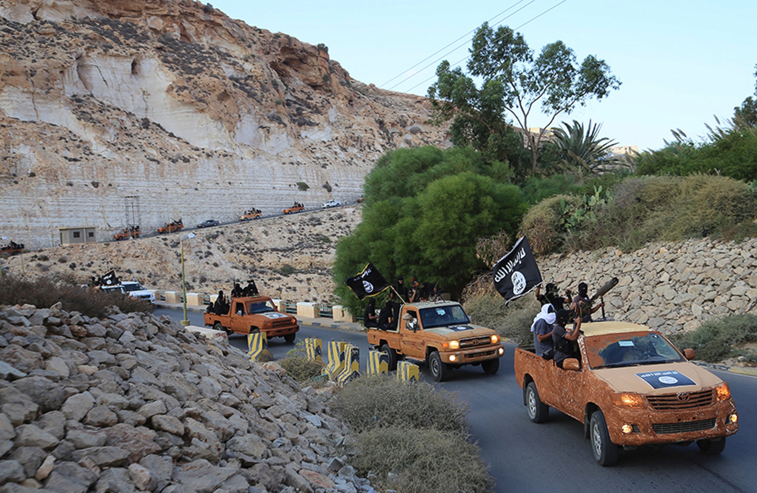 PHOTO: An armed motorcade belonging to members of Derna's Islamic Youth Council drives along a road in Derna in eastern Libya on Oct. 3, 2014.