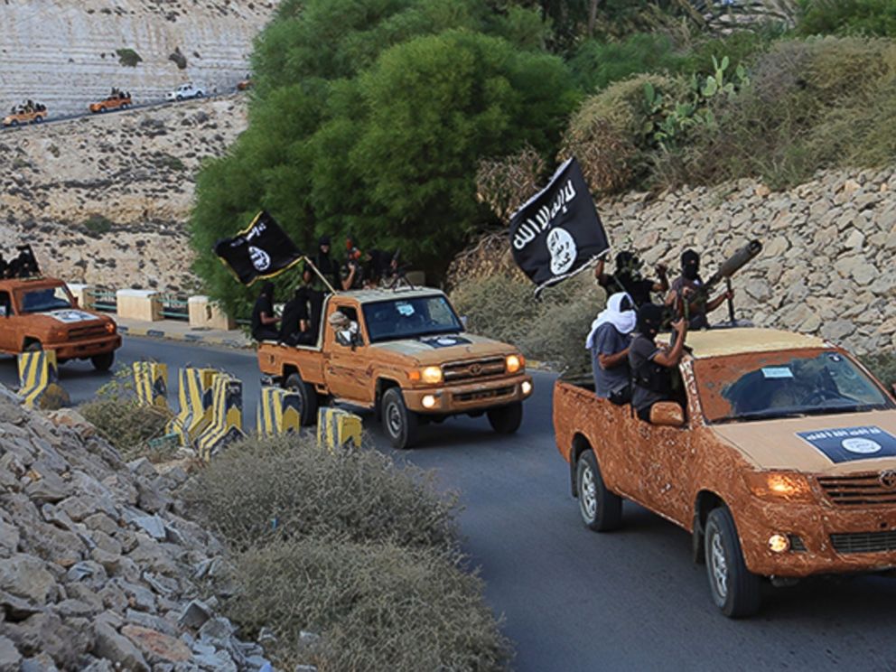 PHOTO: An armed motorcade belonging to members of Dernas Islamic Youth Council drives along a road in Derna in eastern Libya on Oct. 3, 2014.