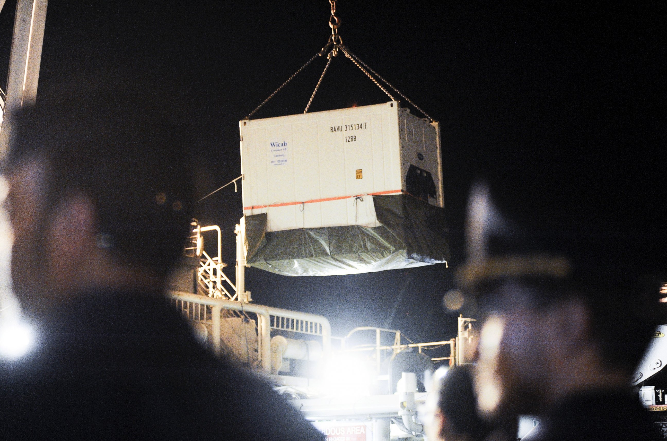 PHOTO: A container containing the bodies of 51 migrants is brought into the Sicilian harbor of Palermo, Italy, from Swedish Coast Guard vessel KBV 001 Poseidon, Aug. 27, 2015.