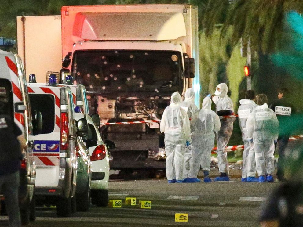 PHOTO: French police forces and forensic officers stand next to a truck that ran into a crowd in Nice, France, July 14, 2016.