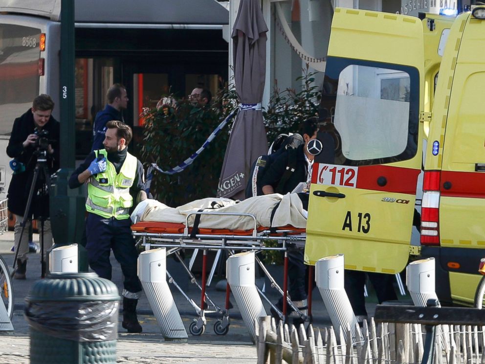 PHOTO: A victim is removed from the scene where shots were fired during a police search of a house in the suburb of Forest near Brussels, Belgium, March 15, 2016.