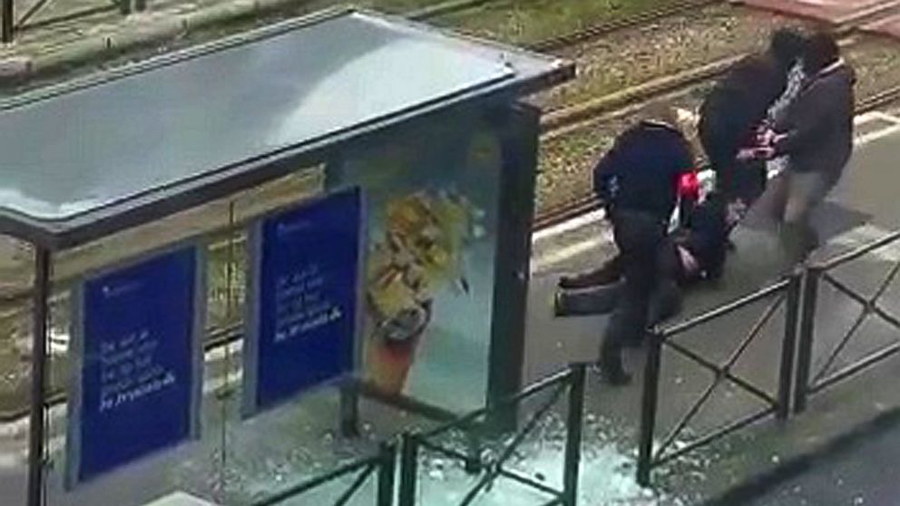 PHOTO: Belgian police drag a man along a rail platform in this still image taken from amateur video in the Brussels borough of Schaerbeek, Belgium, March 25, 2016.