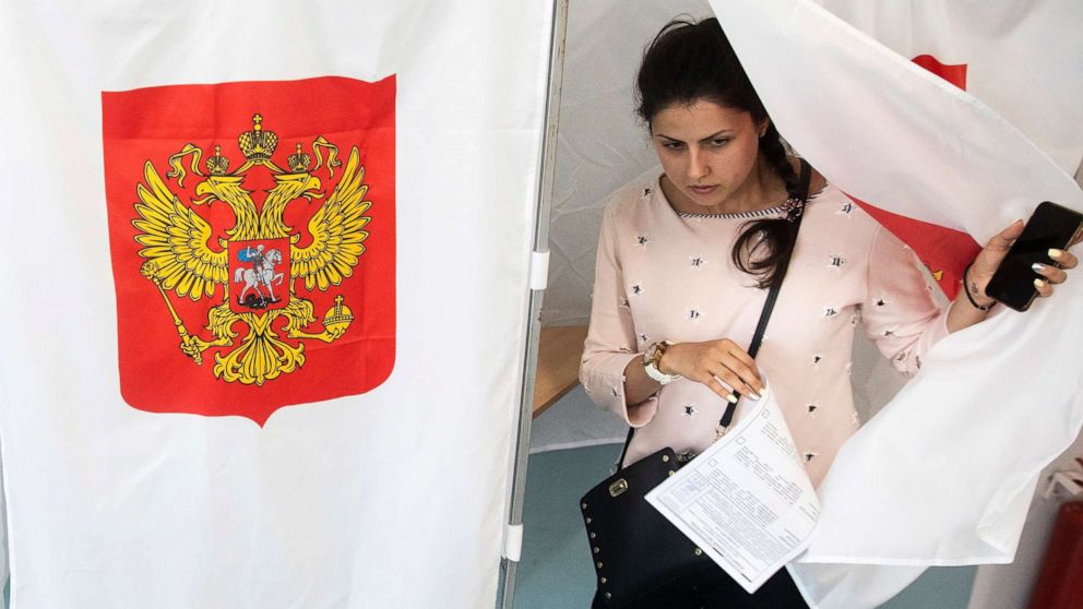 PHOTO: A woman exits a polling booth before casting at a polling station during a city council election in Moscow, Sept. 8, 2019. 