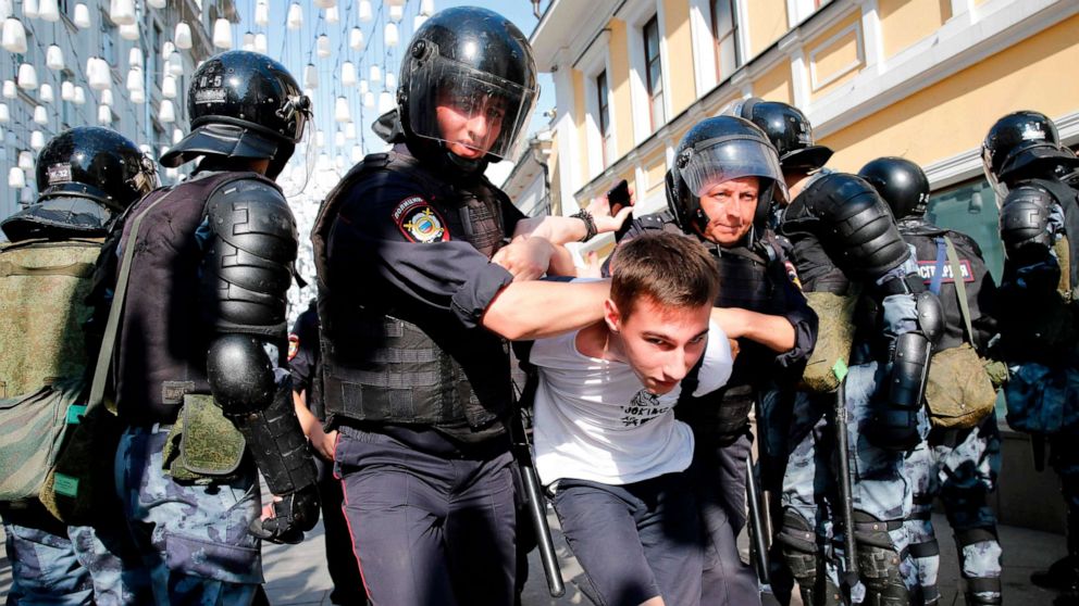 PHOTO: Police officers detain a demonstrator during an unauthorized rally demanding independent and opposition candidates be allowed to run for office in local election in September, in downtown Moscow, July 27, 2019. 
