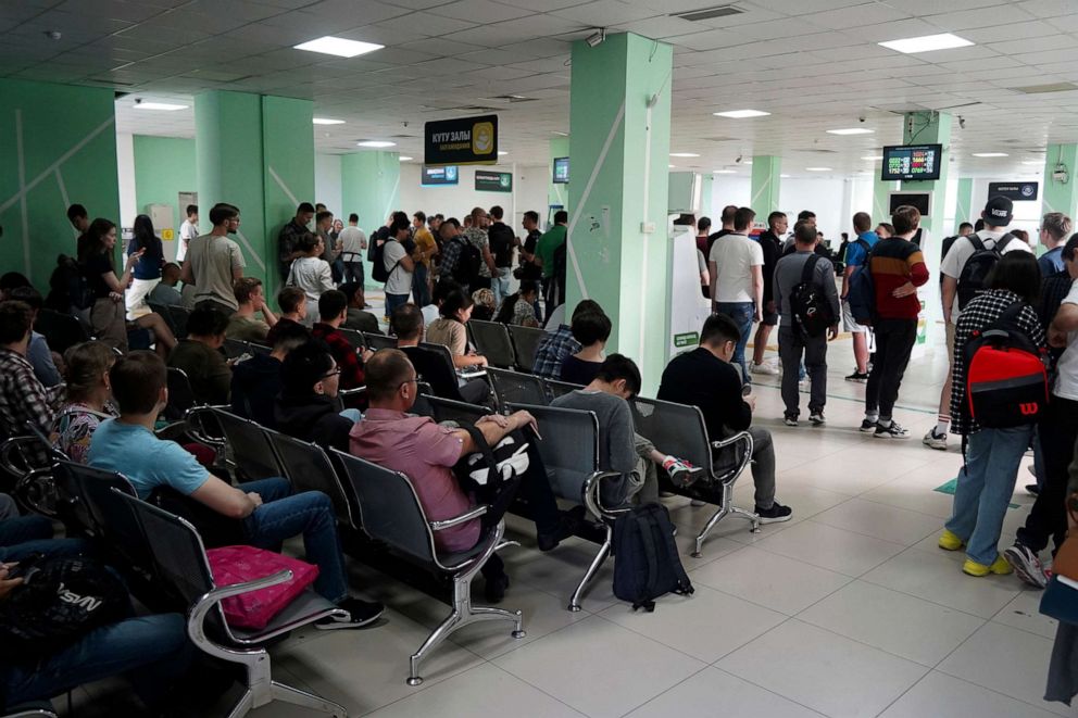 PHOTO: Russians wait and lineup to get Kazakhstan's INN in a public service center in Almaty, Kazakhstan, on Sept. 27, 2022.