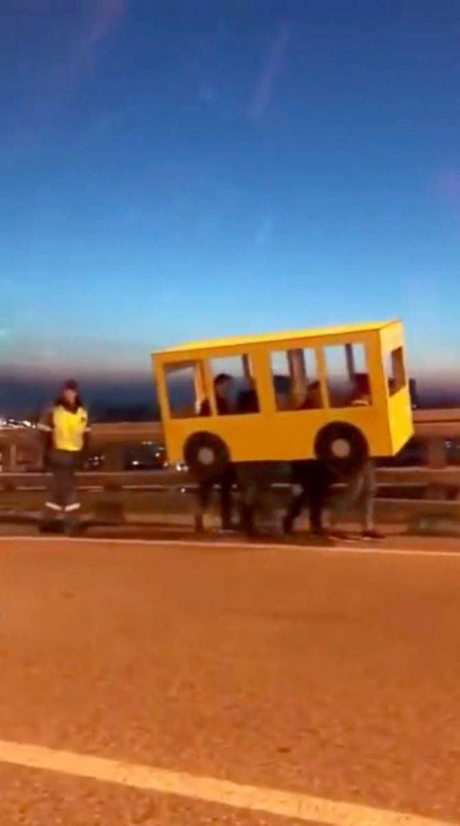 PHOTO: A video shared widely on Russian social media on Nov. 13, 2018, showed four people dressed as a bus walking on the Golden Bridge in Vladivostok, Russia.
