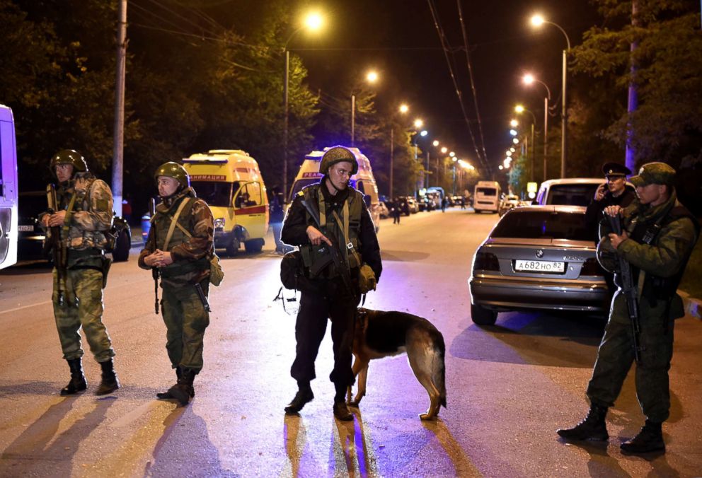 PHOTO: Law enforcement officers stand guard at the site of an attack outside the Kerch Polytechnic College, Oct. 17, 2018, in Kerch, Russia.