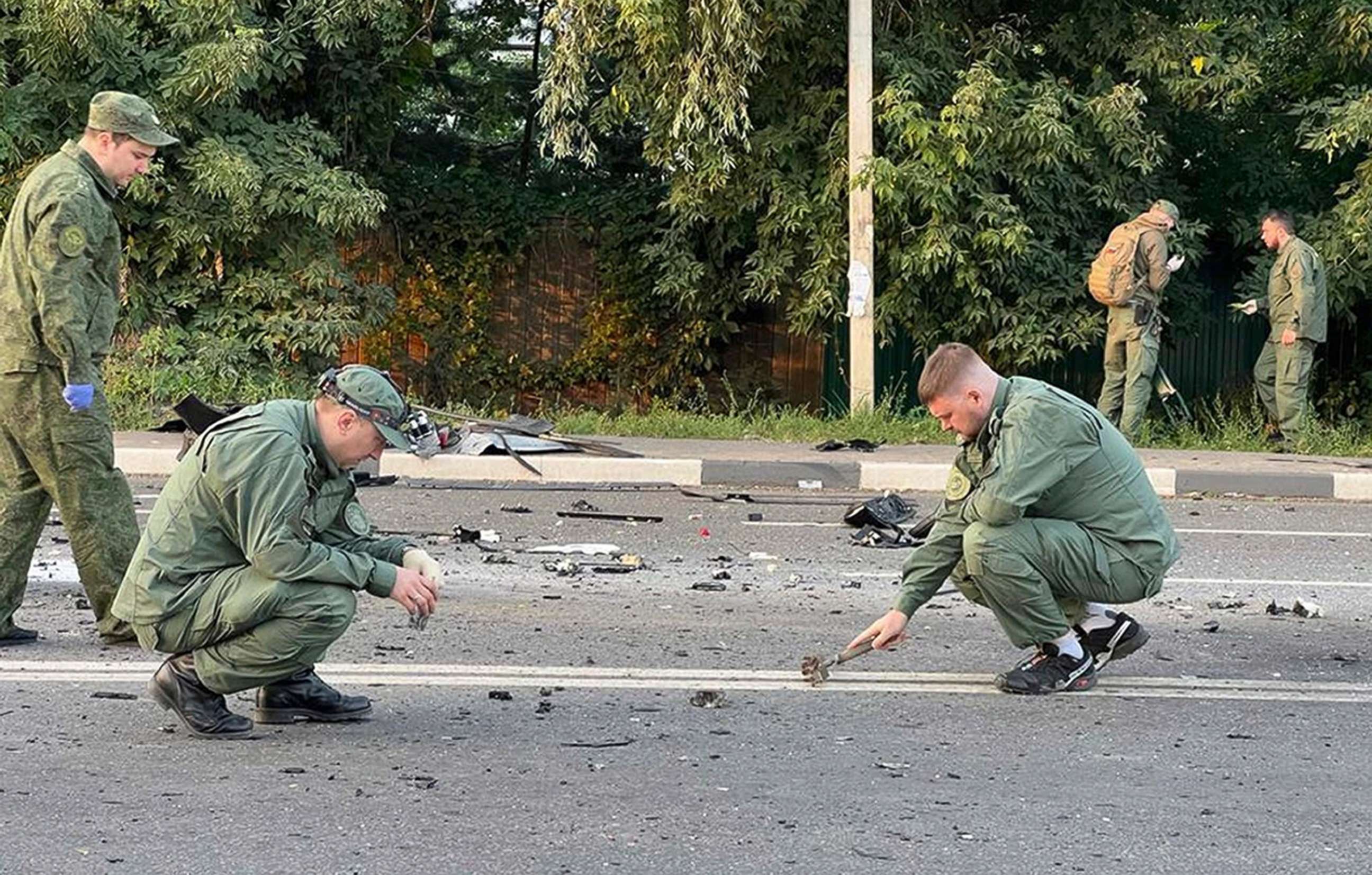 PHOTO: Investigators work on the site of explosion of a car driven by Daria Dugina outside Moscow, Aug. 21, 2022.