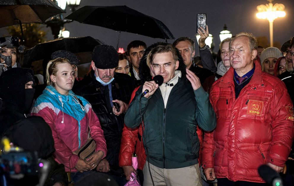 PHOTO: Communist candidate Mikhail Lobanov speaks as Communist Duma Deputy Valery Rashkin, right, listens on during a protest in Moscow, the day after the three-day parliamentary vote ended across Russia, Sept. 20, 2021.