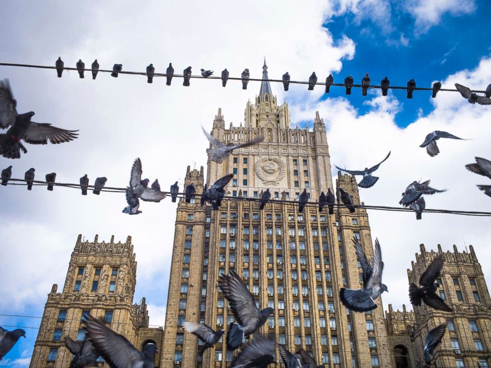 PHOTO: Pigeons take off from wires in front of the Russian Foreign Ministry building, in Moscow, Russia, March 29, 2018.
