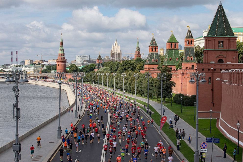 PHOTO: People run past the Kremlin Wall as they take part in a half-marathon in Moscow, Aug., 2, 2020.