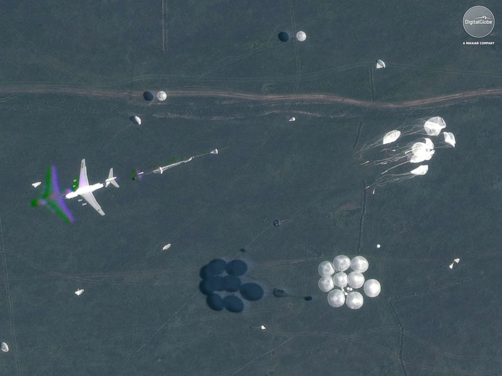 PHOTO: A satellite image shows parachutes deployed in midair during Russias Vostok 2018 military exercises in Tsugol, Russia, on Sep. 13, 2018.