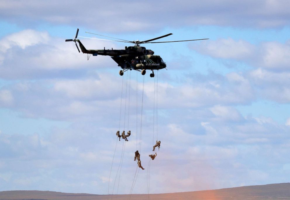 PHOTO: Soldiers rappel from a military helicopter over the training ground "Tsugol", north of the city of Chita during the military exercises Vostok 2018 in Eastern Siberia, Russia, Sept. 13, 2018.