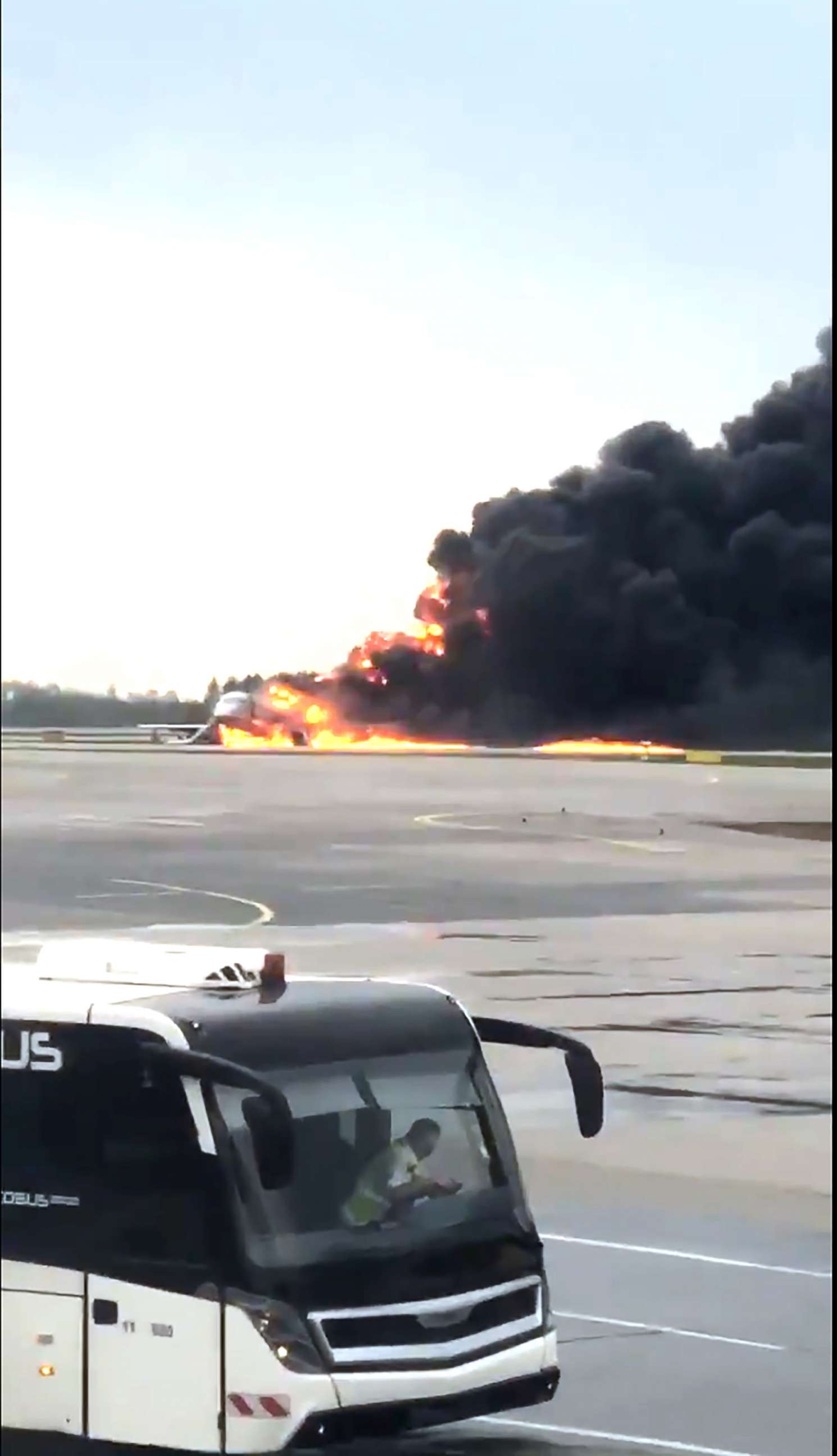 PHOTO: In this image provided by Norenko Mikhali shows smoke rises from a fire on a plane at Moscow's Sheremetyevo airport on Sunday, May 5, 2019.