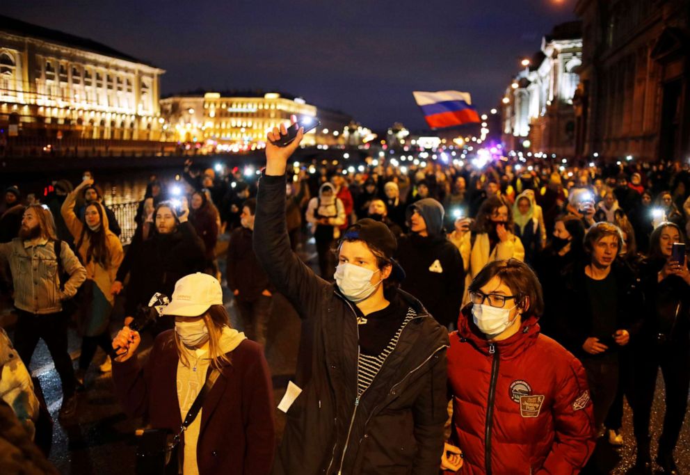 PHOTO: In this April 21, 2021, file photo, demonstrators march during a rally in support of jailed Russian opposition politician Alexei Navalny in Saint Petersburg, Russia.
