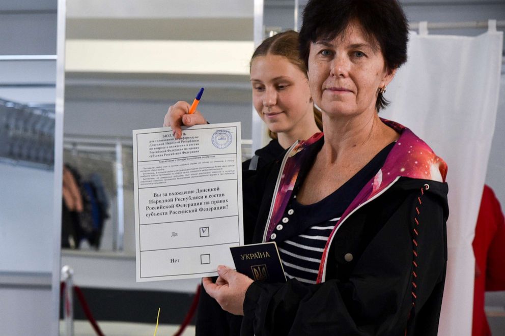 PHOTO: A woman from Donetsk region, the territory controlled by a pro-Russia separatist government, who lives in Crimea, shows her ballot prior to voting during a referendum in Sevastopol, Crimea, Friday, Sept. 23, 2022.