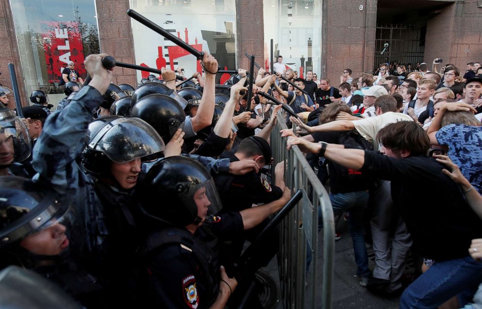 PHOTO: Law enforcement officers clash with demonstrators during a rally calling for opposition candidates to be registered for elections to Moscow City Duma, the capital's regional parliament, in Moscow, July 27, 2019. 
