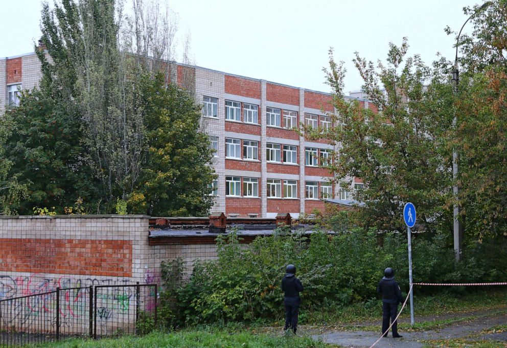 PHOTO: Police officers secure the area near a school after a gunman opened fire there, in Izhevsk, Russia Sept. 26, 2022.