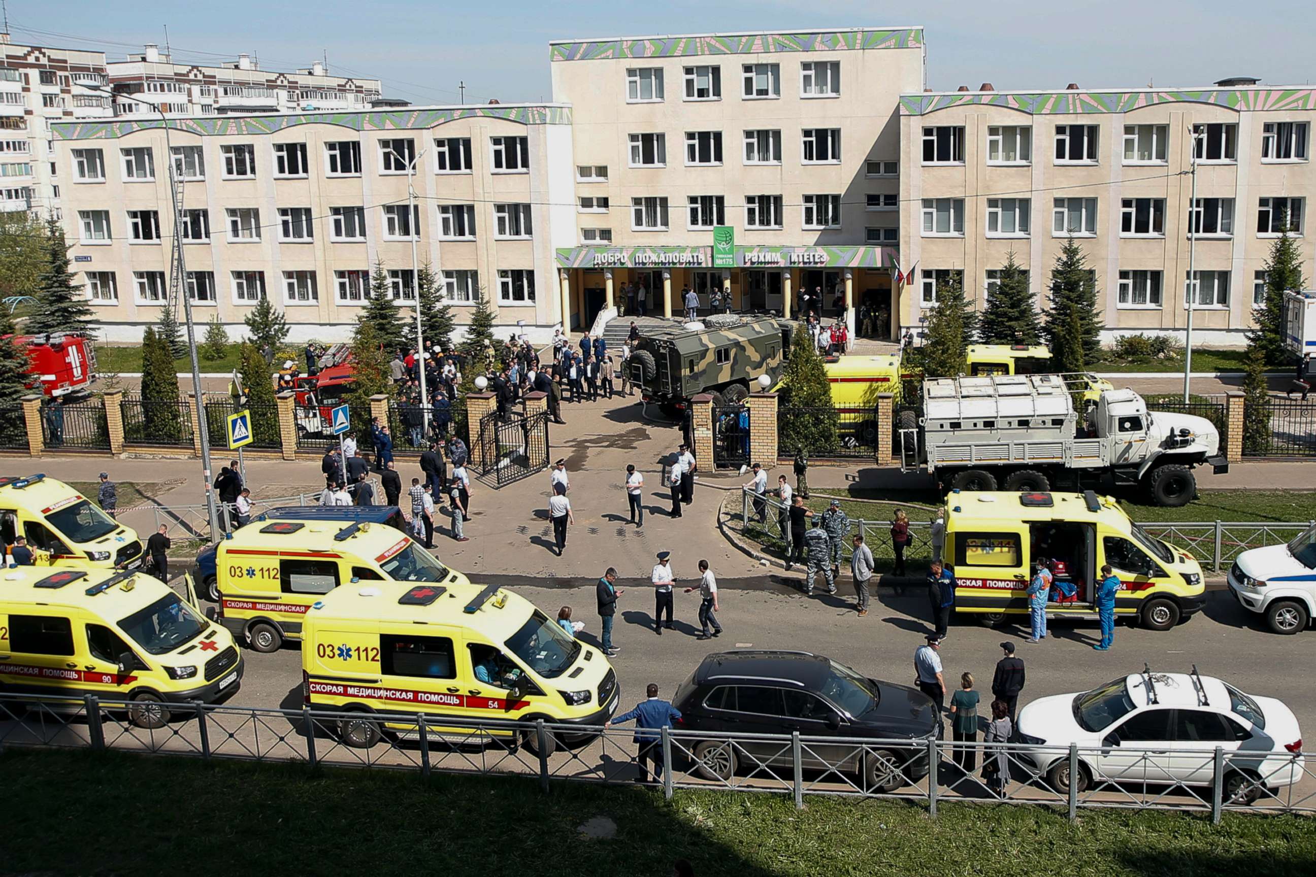 PHOTO: Ambulances and police cars and a truck are parked at a school after a shooting in Kazan, Russia, Tuesday, May 11, 2021. 