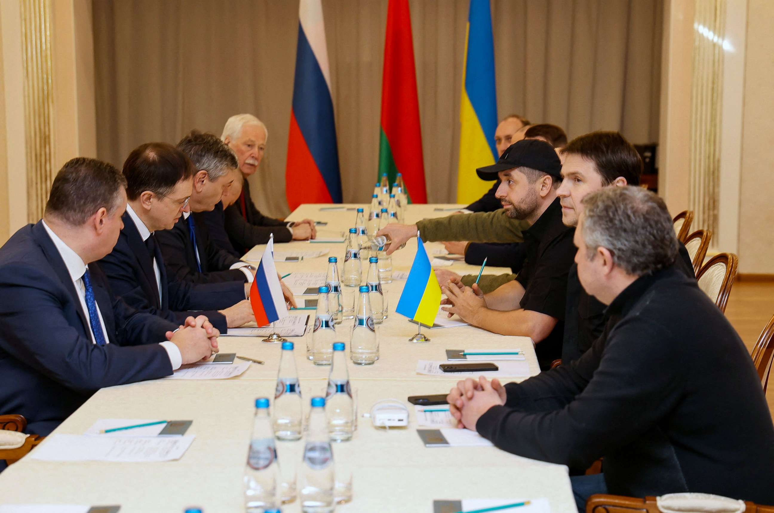 PHOTO: Members of delegations from Ukraine and Russia, including Russian presidential aide Vladimir Medinsky, Ukrainian presidential aide Mykhailo Podolyak, and Ukrainian lawmaker Davyd Arakhamia, hold talks in Belarus on Feb. 28, 2022.