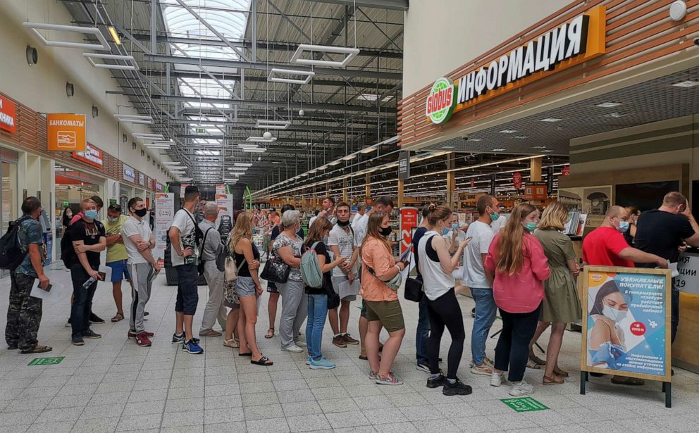 PHOTO: People line up to receive vaccine against the coronavirus disease (COVID-19) at a vaccination centre in the Globus shopping mall in Vladimir, Russia, July 15, 2021.