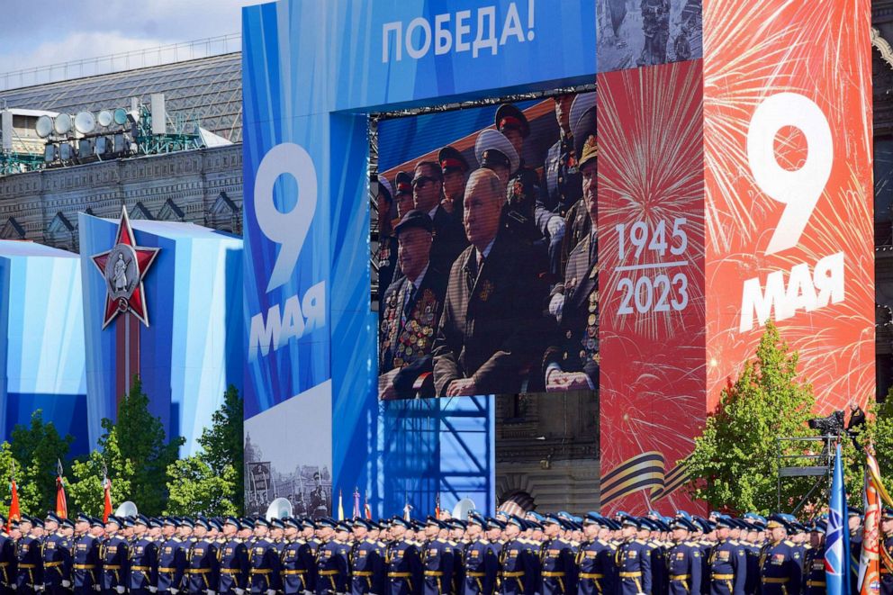 PHOTO: A screen shows Russian President Vladimir Putin looking on as soldiers line up on Red Square during the Victory Day military parade in central Moscow, Russia, May 9, 2023.