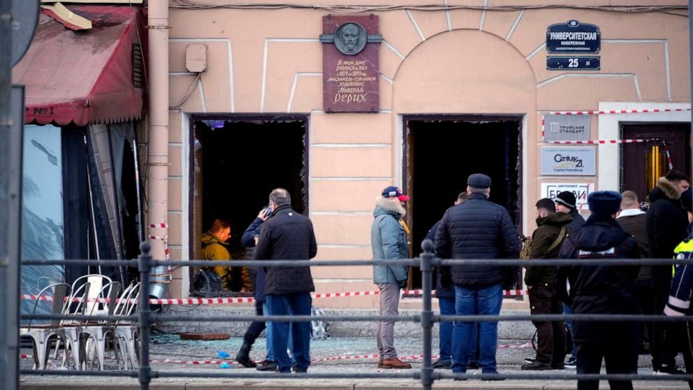 PHOTO: Russian investigators and police officers stand at the side of an explosion at a cafe in St. Petersburg, Russia, April 2, 2023.