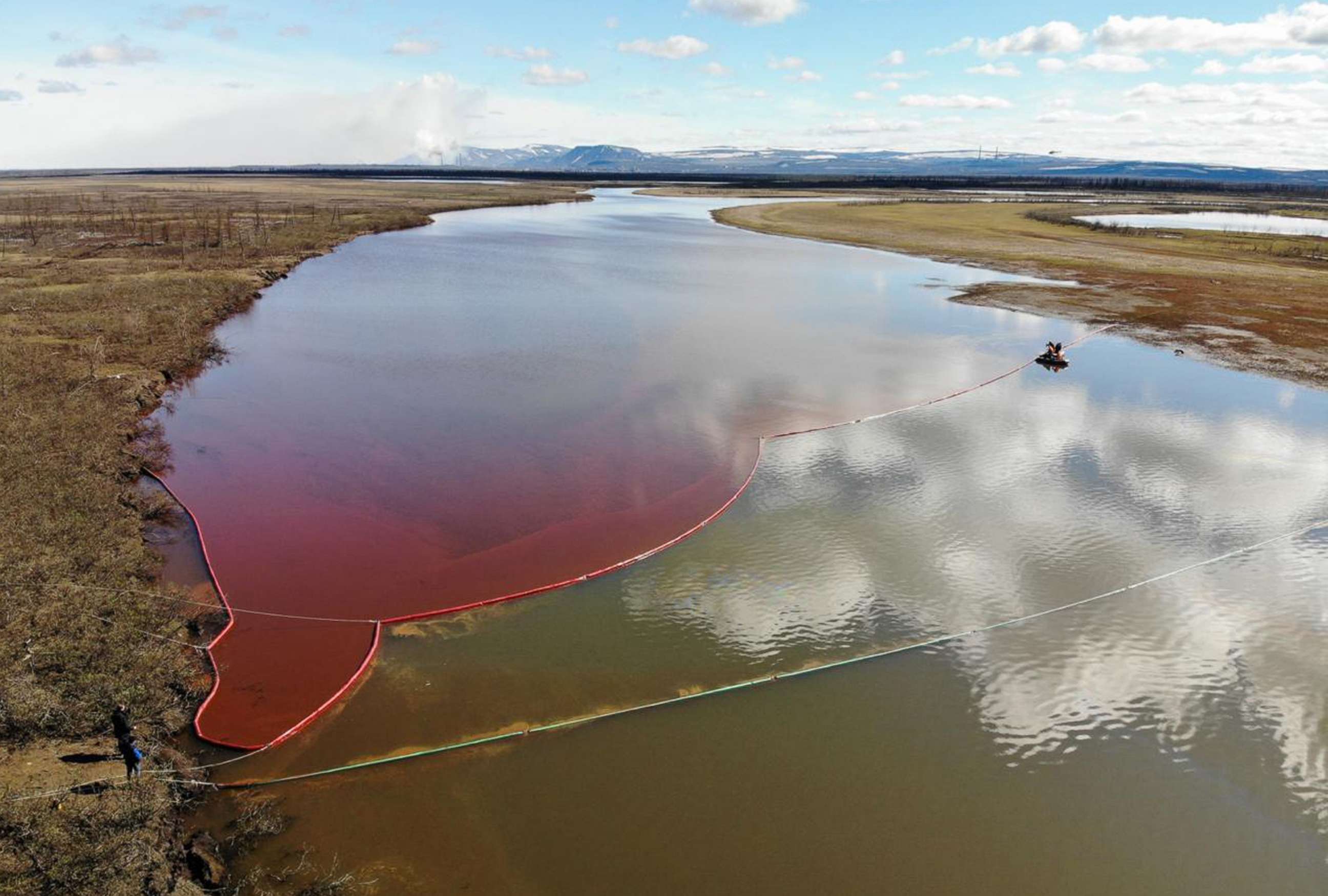 PHOTO: This handout photograph taken and released by the Marine Rescue Service of Russia on June 3, 2020, shows a large diesel spill in the Ambarnaya River outside Norilsk.