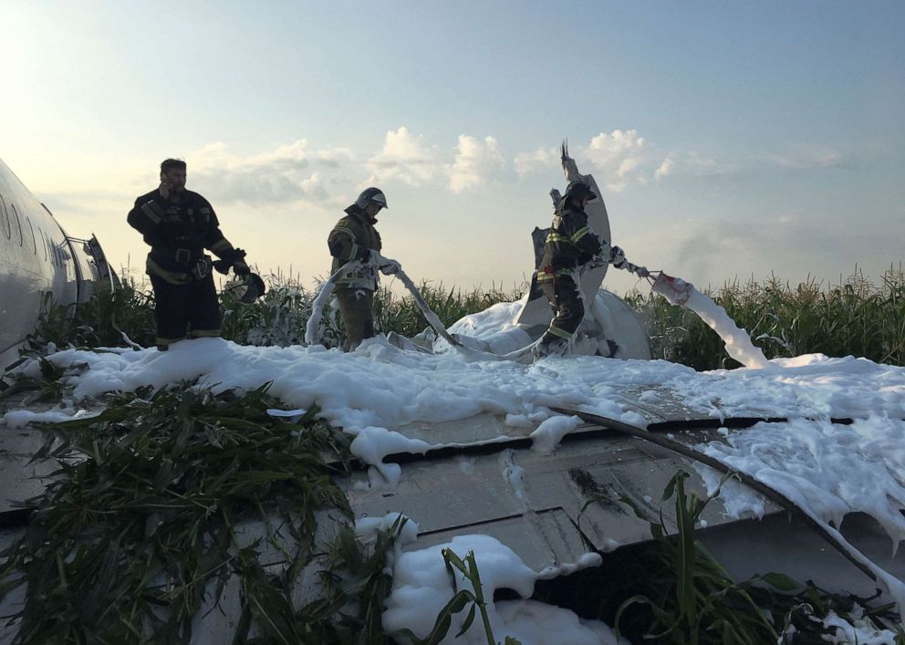 PHOTO: Firefighters spray foam on the Ural Airlines Airbus 321 passenger plane following an emergency landing in a field near Zhukovsky International Airport near Moscow on Aug. 15, 2019.