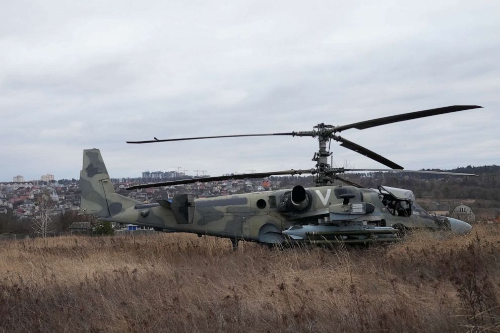 PHOTO: A Russian Ka-52 helicopter gunship is seen in the field after a forced landing outside Kyiv, Ukraine, Feb. 24, 2022.