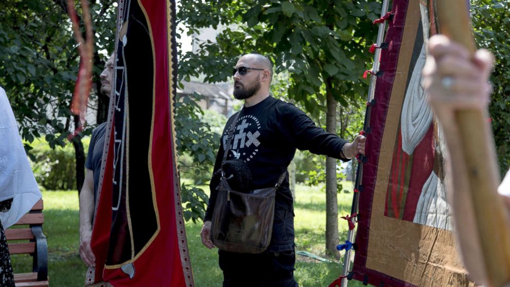 Denis, a member of the Union of Orthodox Banner-Bearers, marches with a banner to commemorate 100 years since the killing of Tsar Nicholas II, in Spaso-Andronikov Monastery in Moscow, July 17, 2018. The Union of Orthodox Banner Bearers is a small fringe group of Russian nationalists with no political power that is convinced Russia should be ruled by an autocratic monarch.