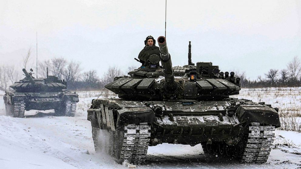 FILE PHOTO: In this photo provided by the Russian Defense Ministry Press Service on Feb. 14, 2022, Russian tanks roll on a field during military drills in Russia's Leningrad region.