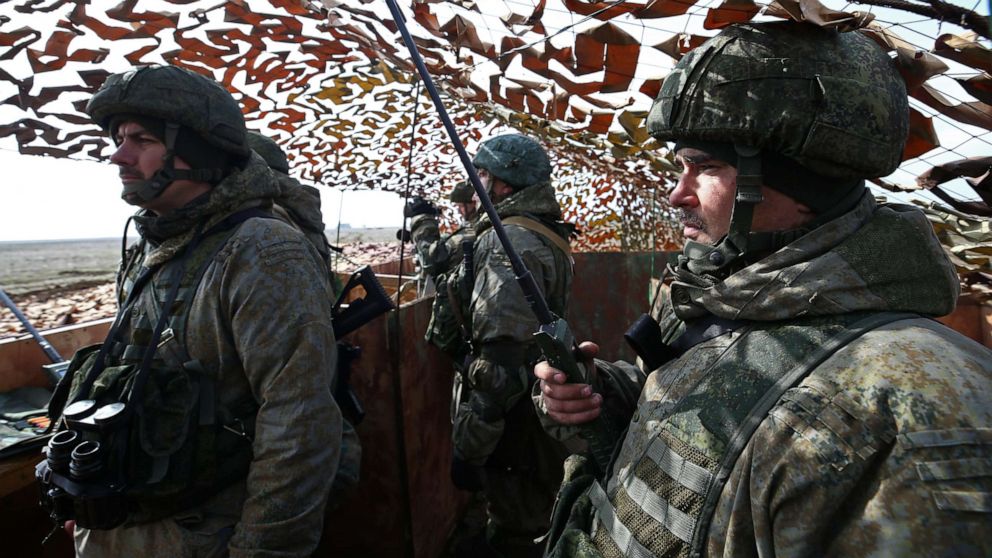 PHOTO: Members of the Russian military are seen at a command point during an exercise held by units of the Novorossiysk guards mountain air assault division of the Russian Airborne Troops at Opuk range in Crimea, March 19, 2021.