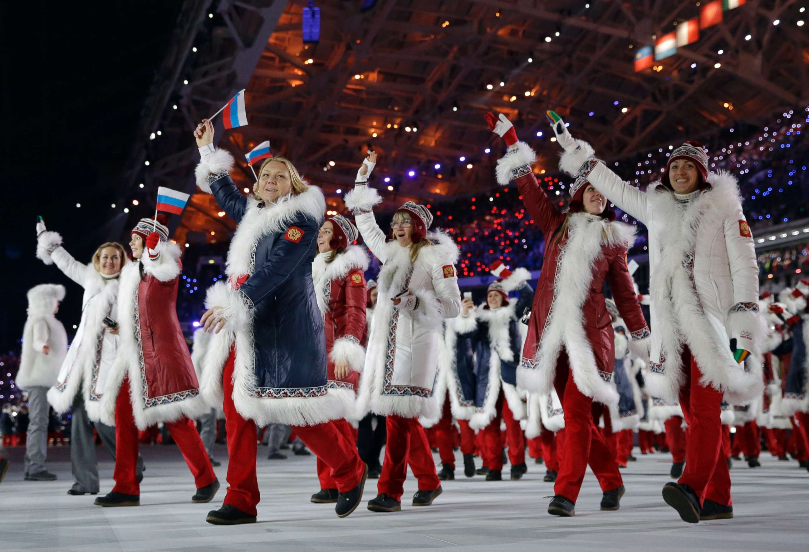 PHOTO: Members of the Russian team cheer as they enter the stadium during the opening ceremony of the 2014 Winter Olympics in Sochi, Russia, Feb. 7, 2014.