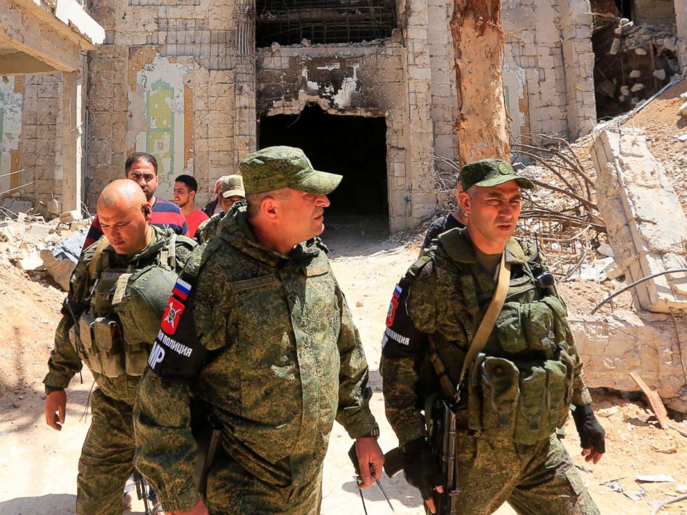 PHOTO: Russian forces patrol damaged buildings in Douma, Syria on the outskirts of Damascus, April 16, 2018, during an organised media tour after the Syrian army declared that all anti-regime forces have left Eastern Ghouta.