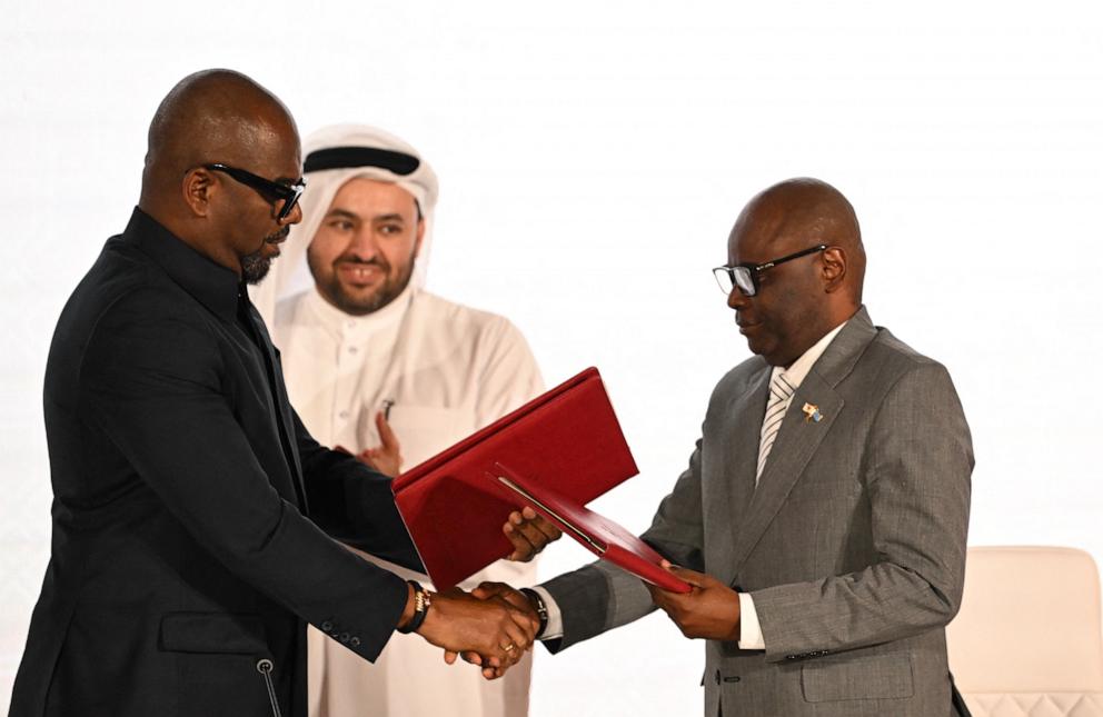 PHOTO: Sumbu Sita Mambu (L), a high representative of the head of state in the Democratic Republic of Congo (DRC) and Rwanda-backed armed group M23 executive secretary Benjamin Mbonimpa (R) shake hands in Doha, on Nov. 15, 2025.