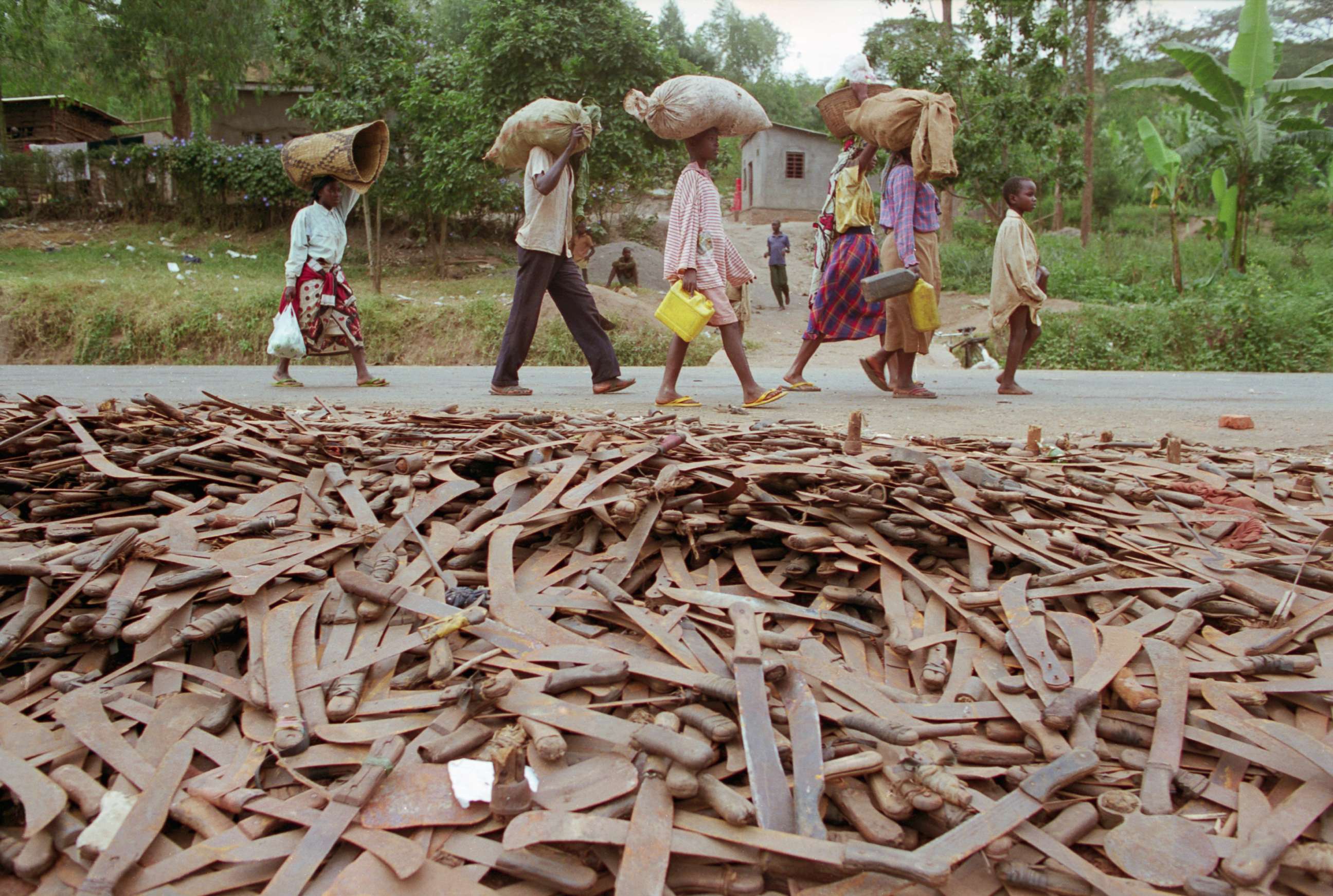 PHOTO: Thousands of abandoned machetes collect at the border of Rwanda and Tanzania, where Hutu refugees fleeing Rwanda are allowed across the border on the condition that they leave behind their weapons, circa 1994.