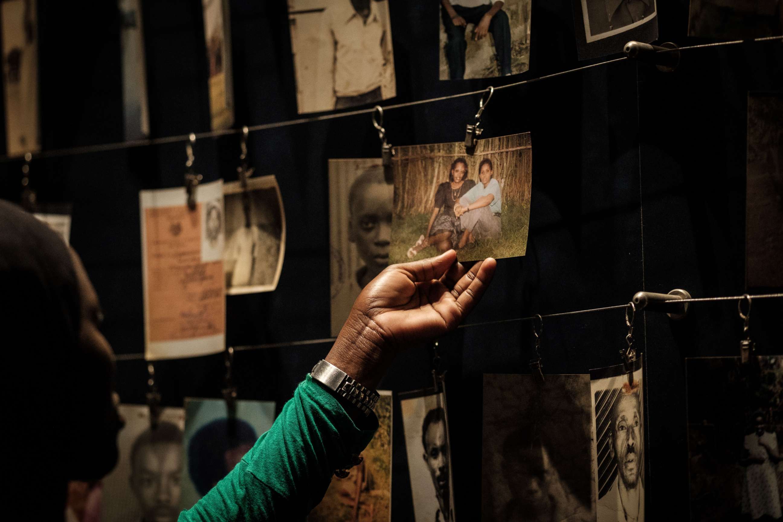 PHOTO: A visitor looking at victims' portraits at the Kigali Genocide Memorial in Kigali, Rwanda, April 29, 2018.