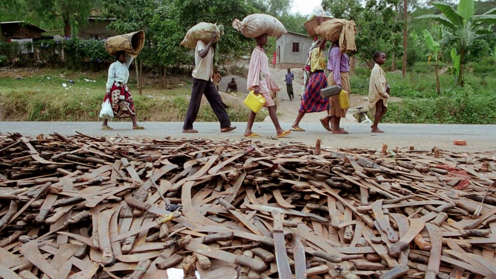 PHOTO: Thousands of abandoned machetes collect at the border of Rwanda and Tanzania, where Hutu refugees fleeing Rwanda are allowed across the border on the condition that they leave behind their weapons in 1994.