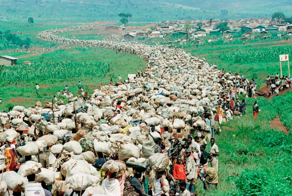 PHOTO: Tens of thousands of Rwandan refugees who were forced by the Tanzanian authorities to return to their country despite fears they will be killed upon their return stream back towards the Rwandan border on a road in Tanzania, Dec. 19, 1996.