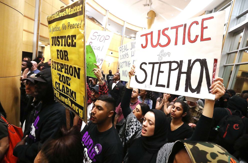 PHOTO: Protesters stand outside council chambers during a special city council meeting at Sacramento City Hall on March 27, 2018 in Sacramento, Calif.