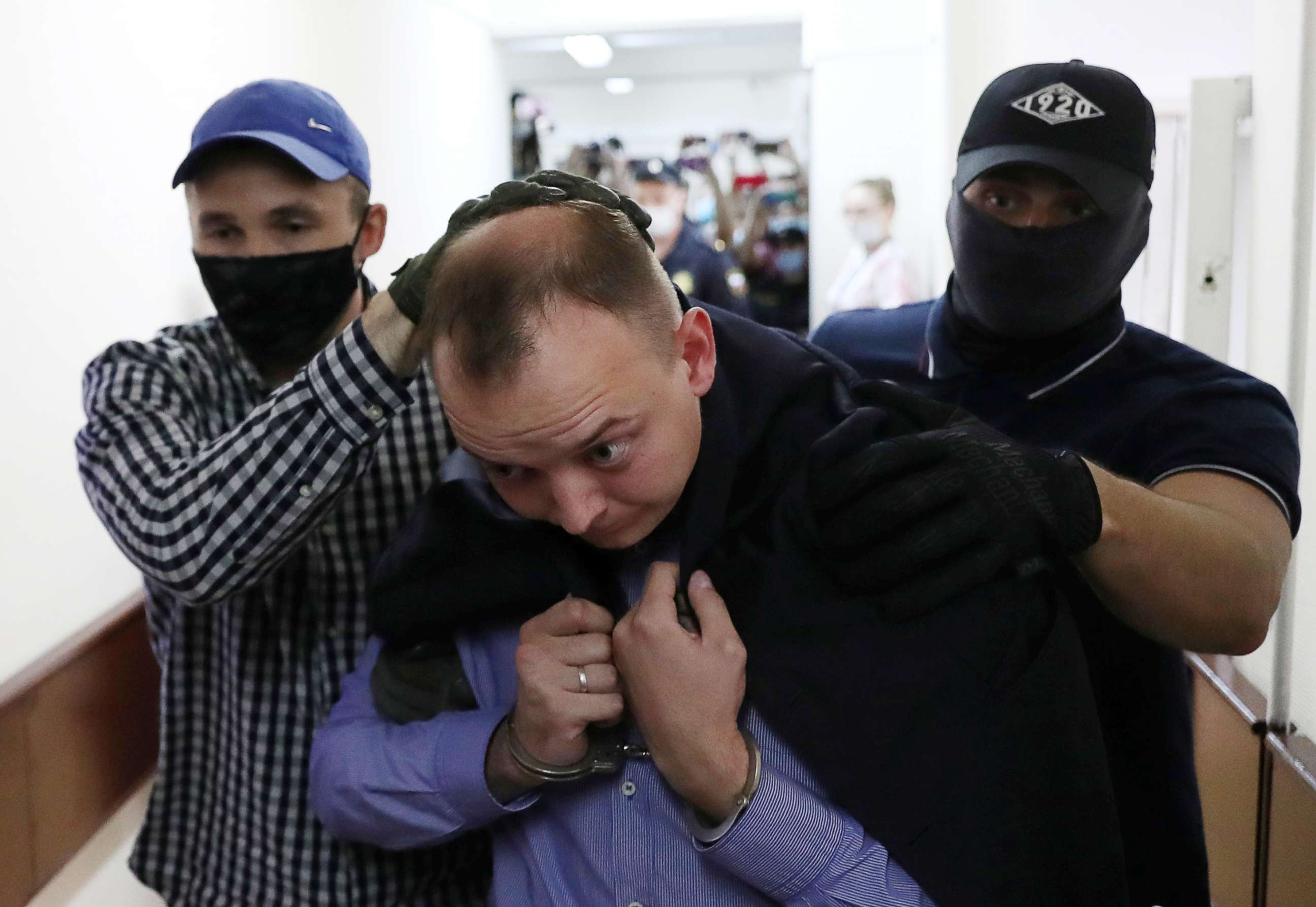 PHOTO: Ivan Safronov, a former journalist who works as an aide to the head of Russia's space agency Roscosmos, detained on suspicion of treason is escorted before a court hearing in Moscow, Russia July 7, 2020. REUTERS/Evgenia Novozhenina