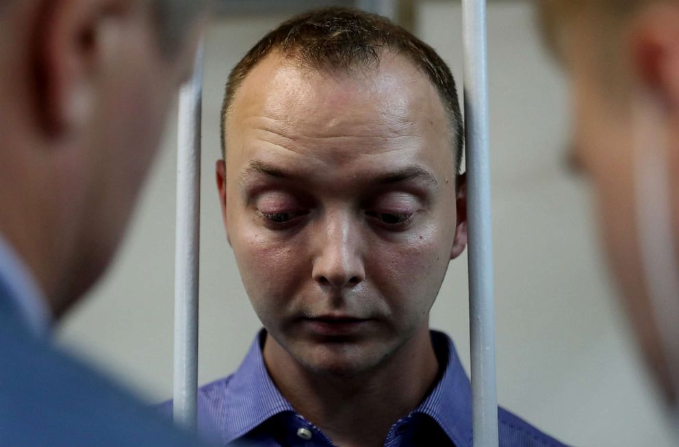 PHOTO: Ivan Safronov, a former journalist who works as an aide to the head of Russia's space agency Roscosmos, detained on suspicion of treason, stands inside a defendants' cage before a court hearing in Moscow, Russia July 7, 2020.