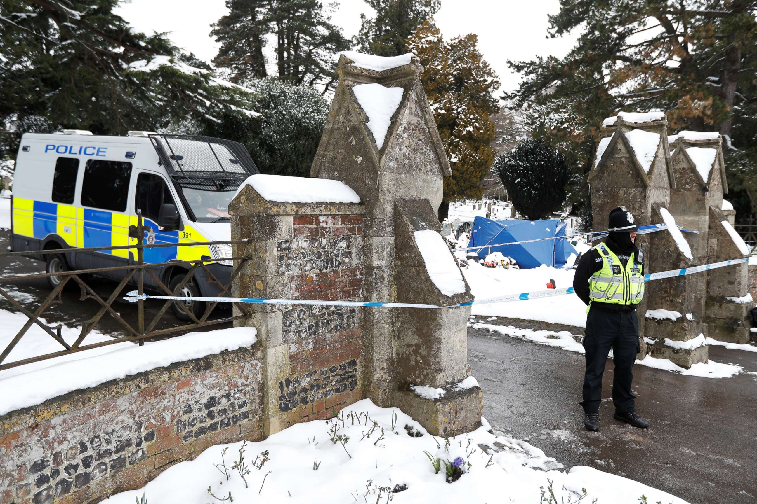 PHOTO: A police officer stands outside the London Road cemetery where the grave of Alexander Skripal, son of former Russian intelligence officer Sergei Skripal, is seen covered with a tent, in Salisbury, Britain, March 19, 2018.