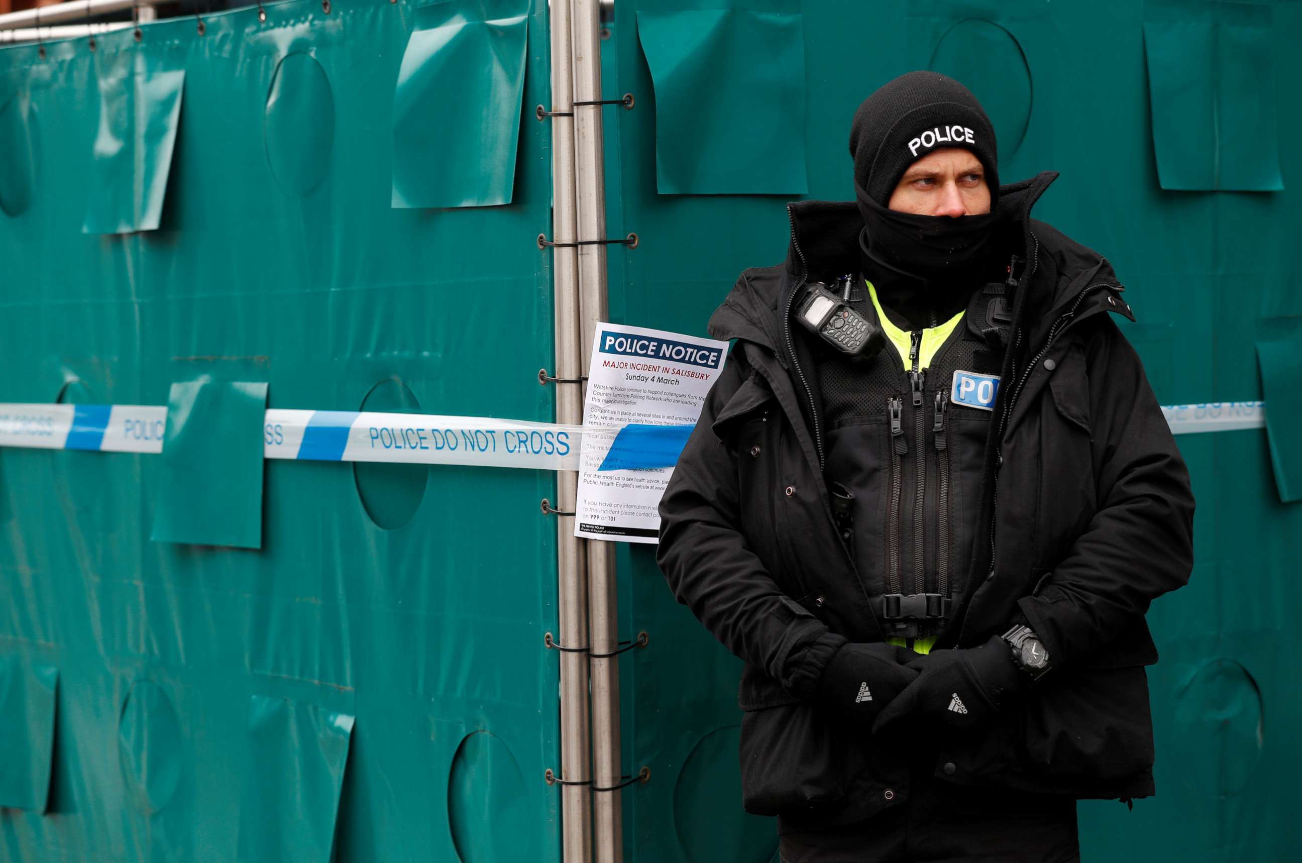 PHOTO: A police officer stands next to screening surrounding a restaurant which was visited by former Russian intelligence officer Sergei Skripal and his daughter Yulia after being poisoned in Salisbury, Britain, March 19, 2018.