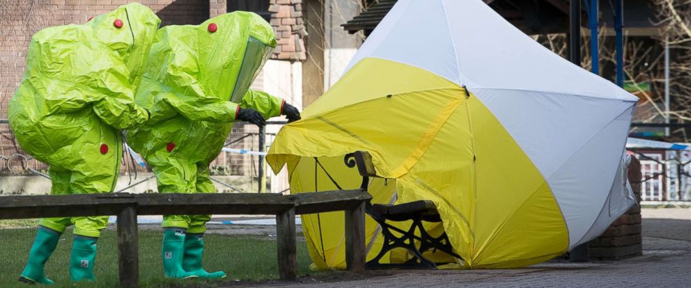 PHOTO: Specialists in protective suits secure the forensic tent on March 8, 2018, that had been blown over by the wind and is covering the bench where Sergei Skripal was found with his daughter after an apparent nerve agent attack, in Salisbury, England.