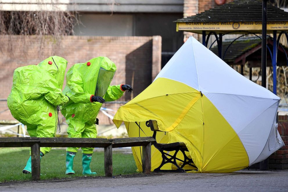 PHOTO: Members of the emergency services re-affix the tent over the bench where Russian spy Sergei Skripal and his daughter Yulia were found in critical condition at the Maltings shopping centre in Salisbury, England.