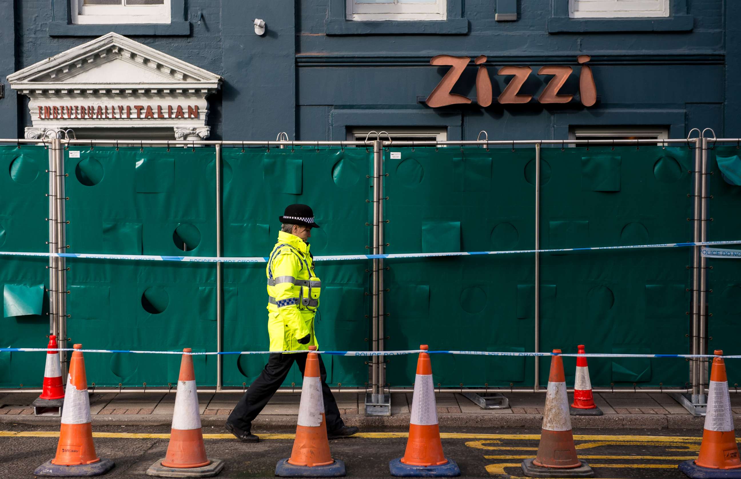 PHOTO: Police officers stand outside Zizzi restaurant as it remains closed as investigations continue into the poisoning of Sergei Skripal on March 11, 2018 in Salisbury, England.